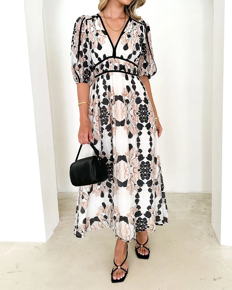 Elegant long dress with puff sleeves and print